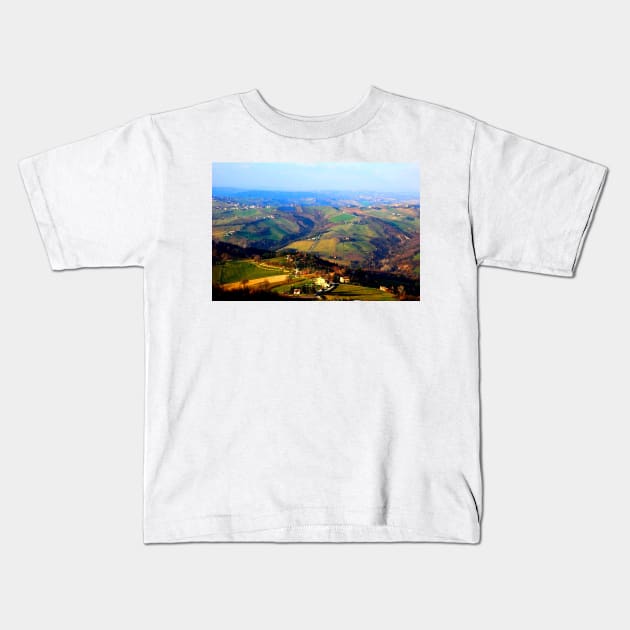 View from above at Marche hills covered by fields and forests Kids T-Shirt by KristinaDrozd